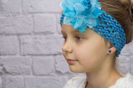 Girl with blue flower on her headの写真素材
