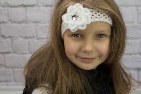 Beautiful girl with flower on her headの写真素材