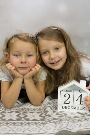 Christmas girls on a light backgroundの写真素材