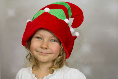 Girl in colorful hat elfの写真素材