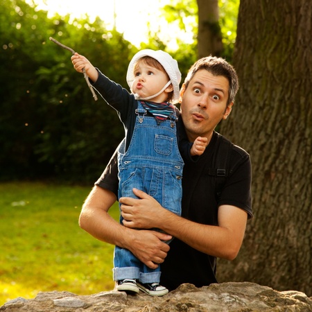 Father and son having fun in the parkの写真素材