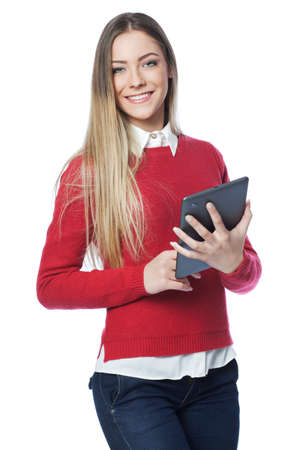 Young woman holding digital tablet, isolated on whiteの写真素材