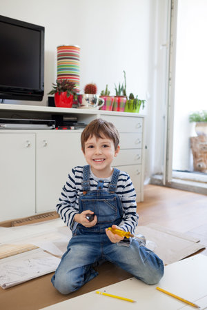 Father and son assembling furniture at homeの写真素材