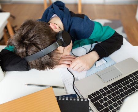 4th grader fell asleep during online class, shallow depth of field