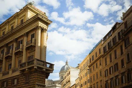 Look up view from roman yellow buildings in a sunny day. On the facade of the building:の写真素材