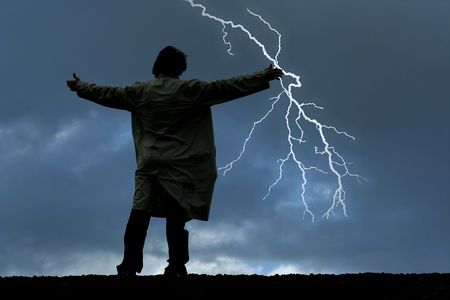 Man watching thunders on a stormy nightの写真素材