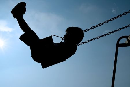 Child swingingの写真素材