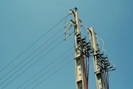 Concrete pole with power lines and insulators.