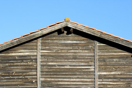 The roof of an old wooded house.の写真素材