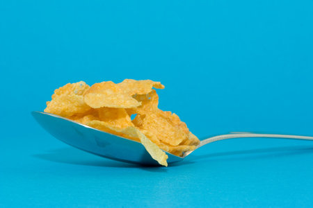 cornflakes isolated on blue background