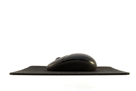 A black computer mouse with mouse pad.