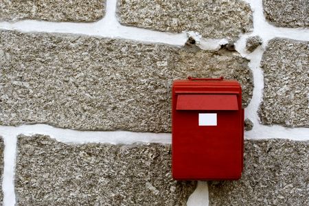 Red mailbox in the wallの写真素材
