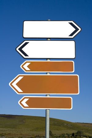 empty arrow signs over blue skyの写真素材
