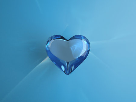 3D render illustration of blue glass heart with caustica on blue background. Concept Valentine's day romantic.の写真素材
