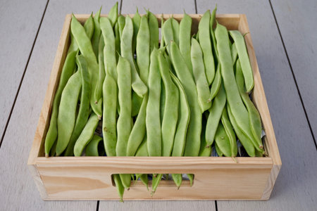 green fresh beans in a wood box