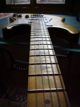 Isolated guitar on table in colorの写真素材