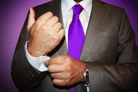 Business man with violet tie on violet backgroundの写真素材