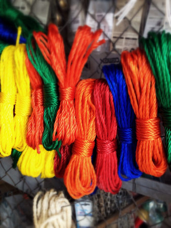 Colored ropes hanged, textured background