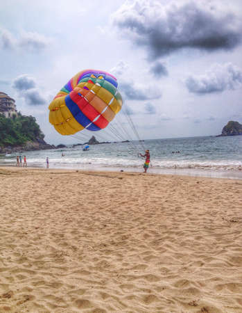 Rainbow parachute at the beachの素材