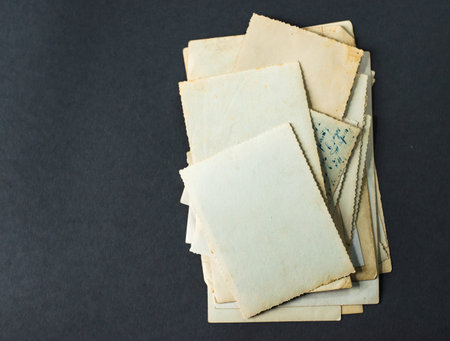 old photos lie on gtey table, vintage