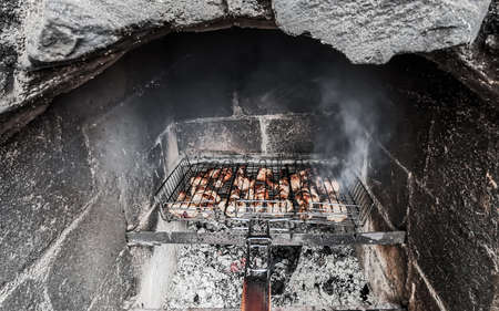 Grilling marinated chiken shashlik on a grill.の写真素材