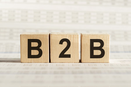 B2B abbreviation - business marketing, on wooden cubes on a light background.