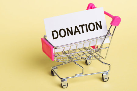 The word DONATION stands for return on investment, on a card, on a yellow background with a shopping...
