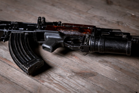 Automatic weapons assault rifle on wooden background. close up viewの写真素材