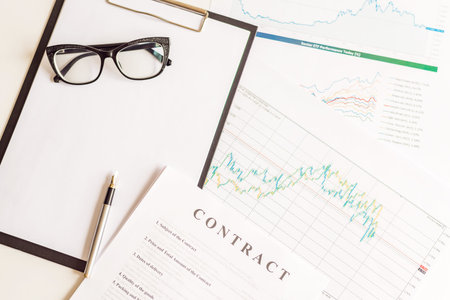 Contract with ink pen and glasses in business work on office desk