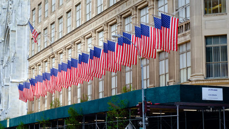 Row of American flags on Saks Fifth Avenue, New York City - July 10, 2016, 5th Avenue, New York...