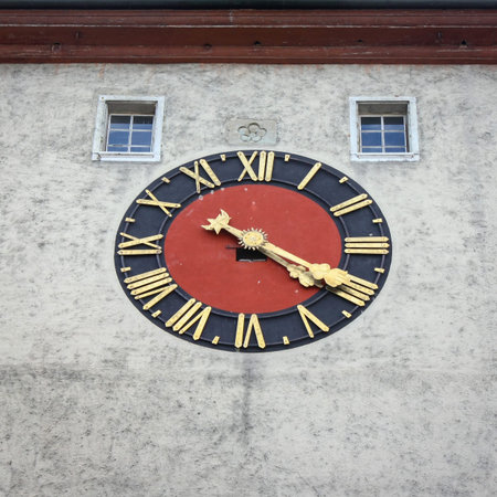 Closeup of an analogue clock on a Biel gate - Bieltor - bell tower in Solothurn, Switzerland.の写真素材