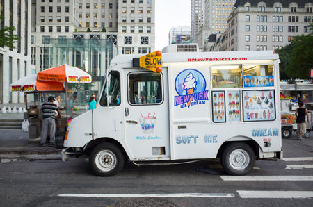 White ice cream truck and Nuts4nuts food cart in front of Apple store - July 17, 2016, 59th Street,...
