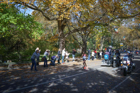 Mary Keitany New York Marathon 2016 womens winner running by the crowd of spectators in Central Park before 25 mile marker - November 6, 2016, East Drive, New York City, NY, USAのeditorial素材