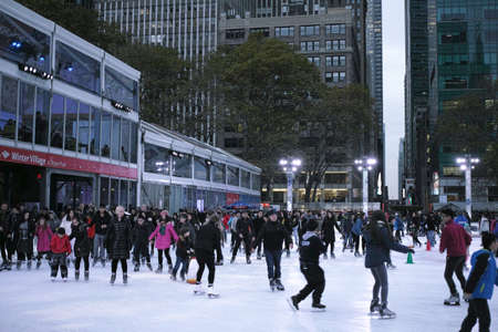 People ice skating in Bryant Park on Thanksgiving day - November 24, 2016 6th Avenue, New York City, NY, USAのeditorial素材