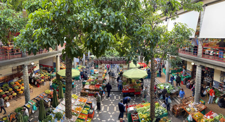 Funchal at Madeira, Portugal - December 18, 2021: Vendors selling fresh fruits and vegetables at famous market Mercado dos Lavradores in Funchal, capital city of Madeira Island, Portugalのeditorial素材