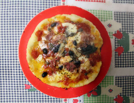 pizza served on table の写真素材