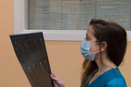Healthcare personnel observing an x-rayの写真素材