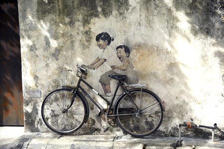 PENANG MALAYSIA  APRIL 26 2015: Penang street art  kids on bicycleのeditorial素材