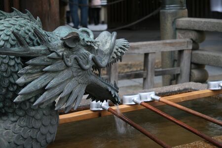 Dragon fountain in a japanese templeの写真素材