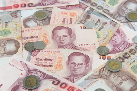 Random Thai Baht coins and banknotes as backgroundの写真素材
