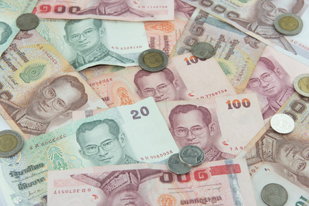 Random Thai Baht coins and banknotes as backgroundの写真素材