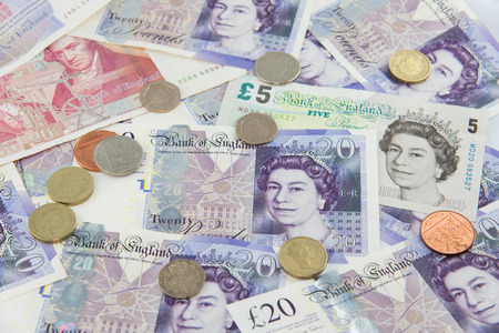 Random Pound Sterling banknotes and coinsの写真素材