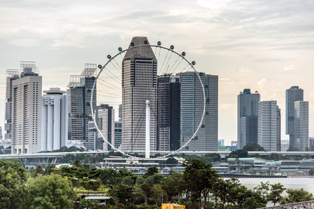 SINGAPORE: 1 October 2016: View of Singapore flyer, the largest ferris wheel in Singapore with skyline as backgroundのeditorial素材