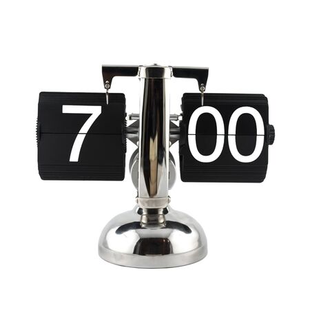 Isolated vintage flip clock on white background at seven o'clockの写真素材