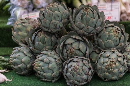Fresh artichokes sold on the marketの写真素材
