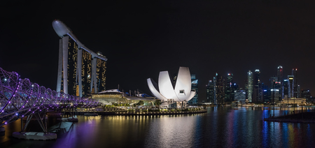 View of Singapore skyline at night with Helix bridge, Hotel Marina Bay Sands and art science museumのeditorial素材