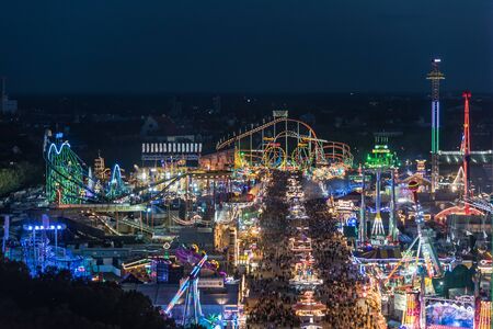 MUNICH, GERMANY - 22 SEPTEMBER 2017: Aerial view of Oktoberfest from St. Paul Cathedral at nightのeditorial素材