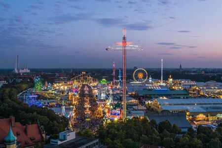 MUNICH, GERMANY - 22 SEPTEMBER 2017: Aerial view of Oktoberfest from St. Paul Cathedral during sunsetのeditorial素材