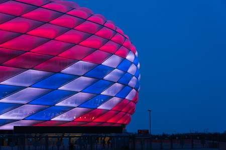 Munich, Germany - February 27, 2018: Allianz Arena special illumination for Bayern Munich 118th Birthday with bright red and white diamondsのeditorial素材