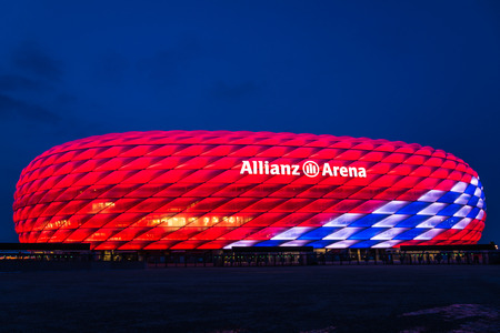 Munich, Germany - February 27, 2018: Allianz Arena special illumination for Bayern Munich 118th Birthday with bright red and white diamondsのeditorial素材
